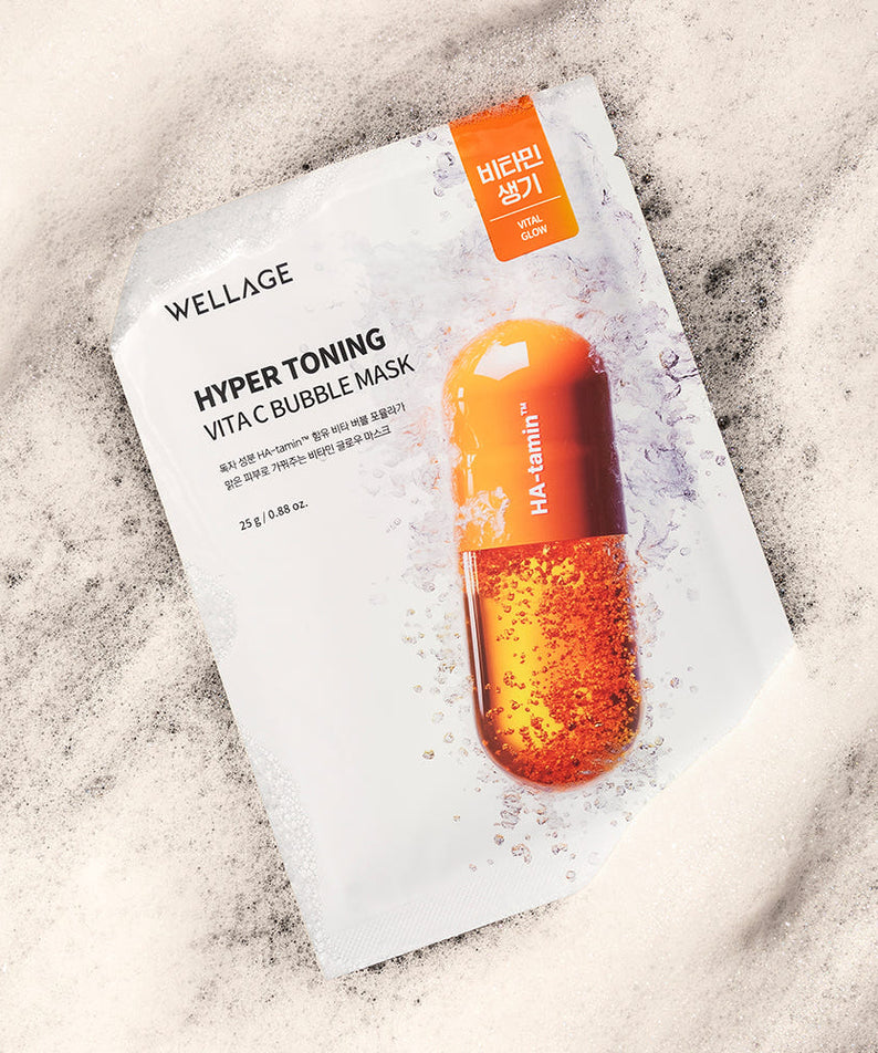 WELLAGE  Hyper Toning Vita C Bubble Mask 25gx5 sheets : masque visage en feuille sur fond marbre, sachet blanc avec bulles orange.
