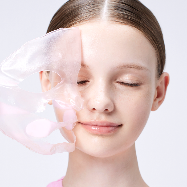 Woman using COSRX Peptide Collagen Lifting Glow Hydrogel Mask from Ma Petite Corée, showcasing skincare benefits.