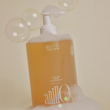 Décris l'image en français en mentionnant le produit, la marque et le contexte visuel : ANILLO Amber528 Scented Hand & Body Wash 450ml
