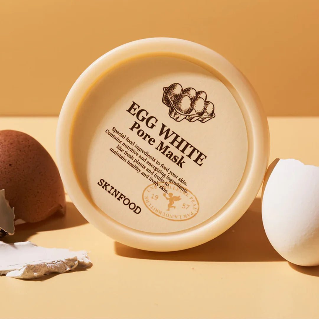 SKINFOOD Egg White Pore Mask 120g, pot crème sur fond orange avec œuf et ingrédients, marque SKINFOOD en gros plan